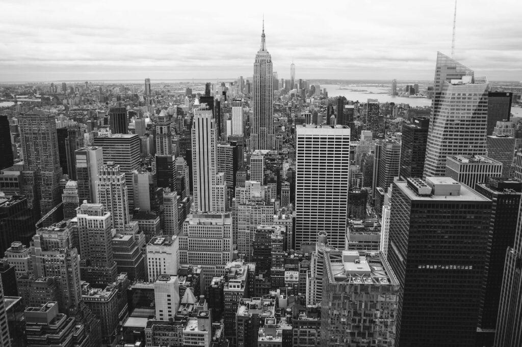 An overview shot of a bustling city, full of skyscrapers, office buildings, and apartments.